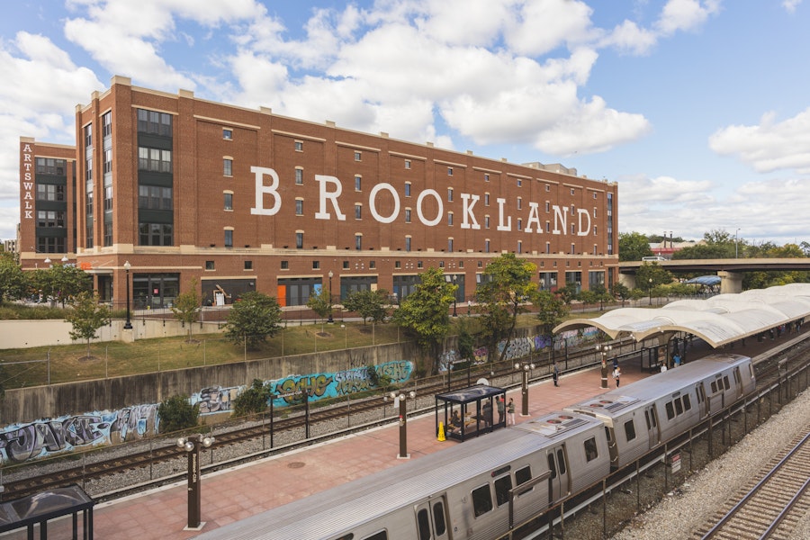 Brookland Metro stop with brick building and trees