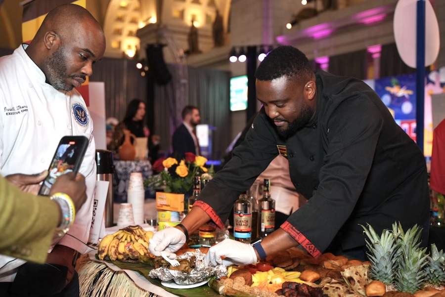 Two chefs prepare and present dishes at an international food showcase in Washington, DC.