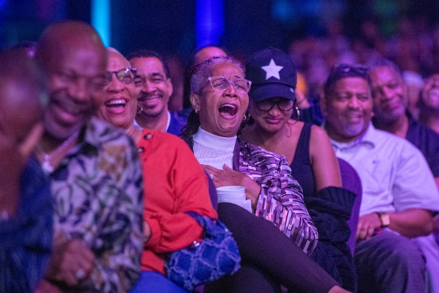 Audience members laugh and enjoy a live comedy show in Washington, DC.
