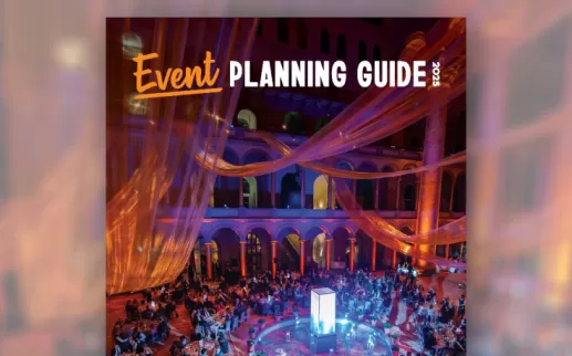 Cover of the 2025 Event Planning Guide, showing a colorfully-lit event in a historic building. 
