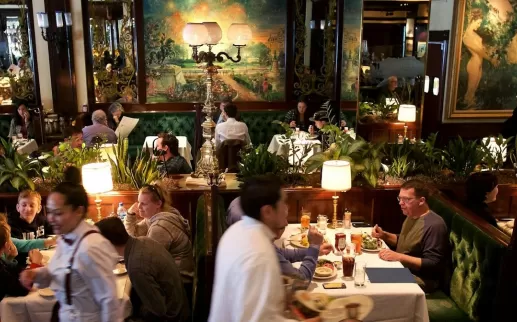 Inside a bustling restaurant with an old-school vibe and decorative art. 