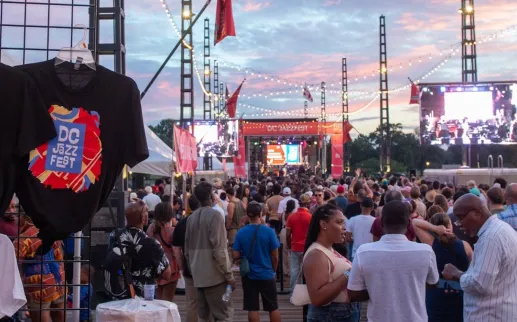 Crowds attend a vibrant jazz festival on the Wharf in Washington, DC.
